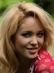 Zemani.com Alissa - Very beautiful blond girl takes her pink clothes off and has a rest outdoor on a green grass.